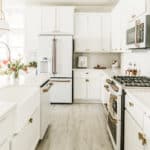 All-white kitchen design with white cabinets and white appliances