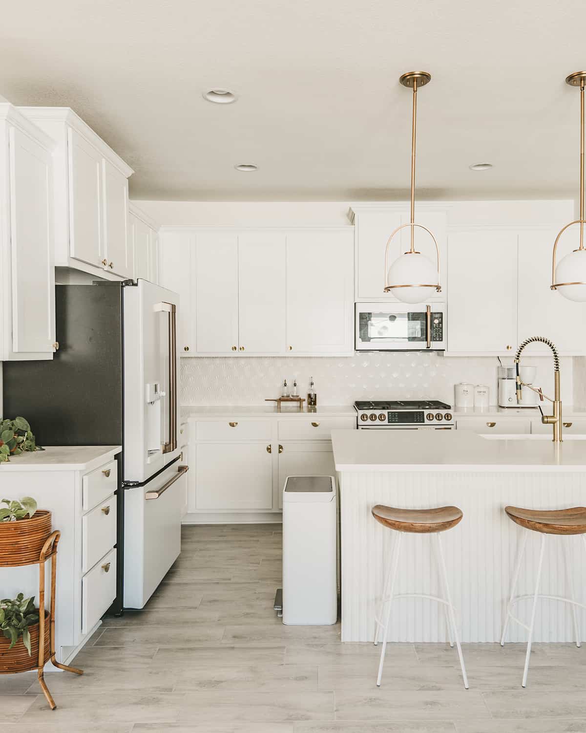 All-white kitchen design with white cabinets and white appliances | GE Cafe appliances