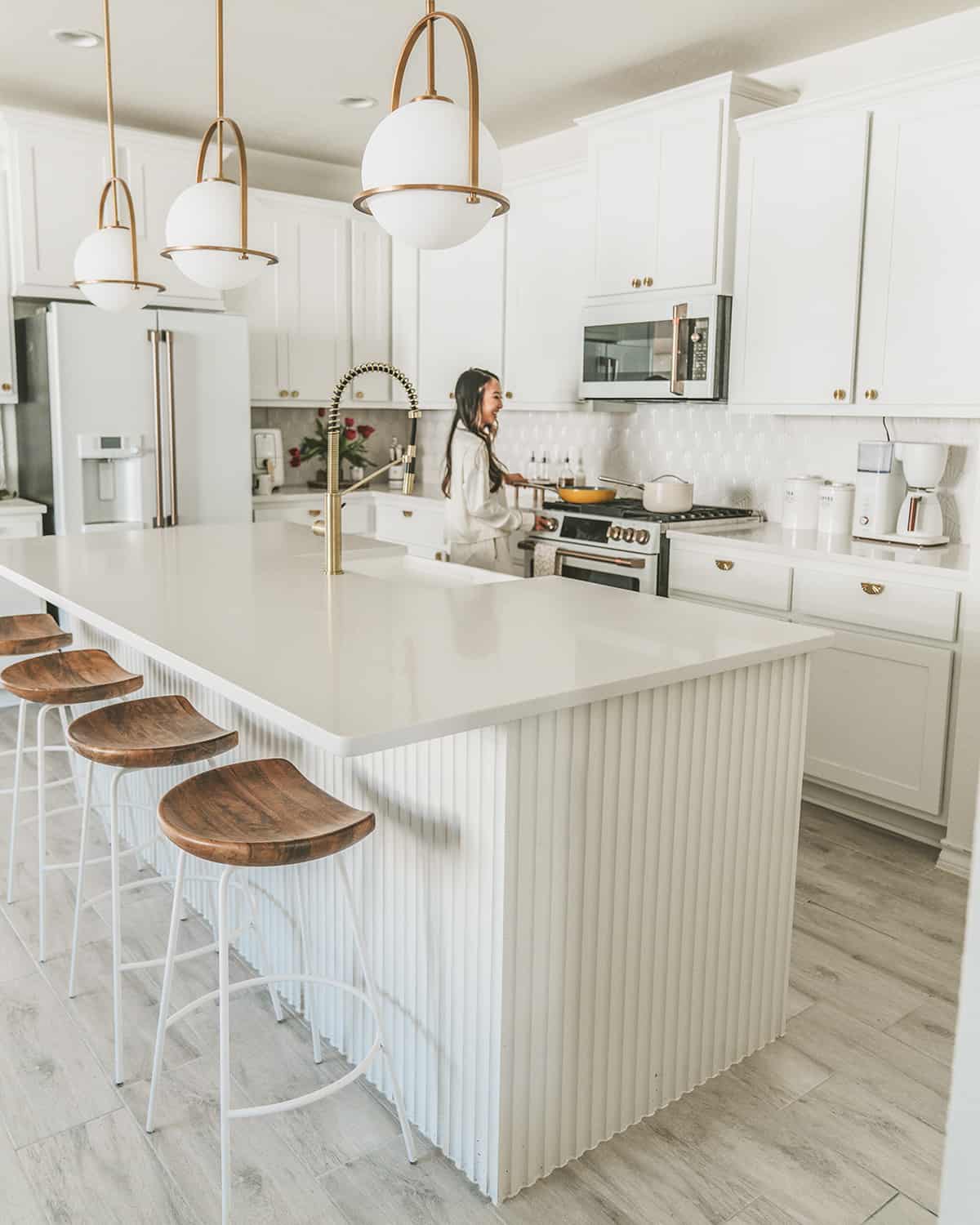 All white kitchen with white cabinets and appliances