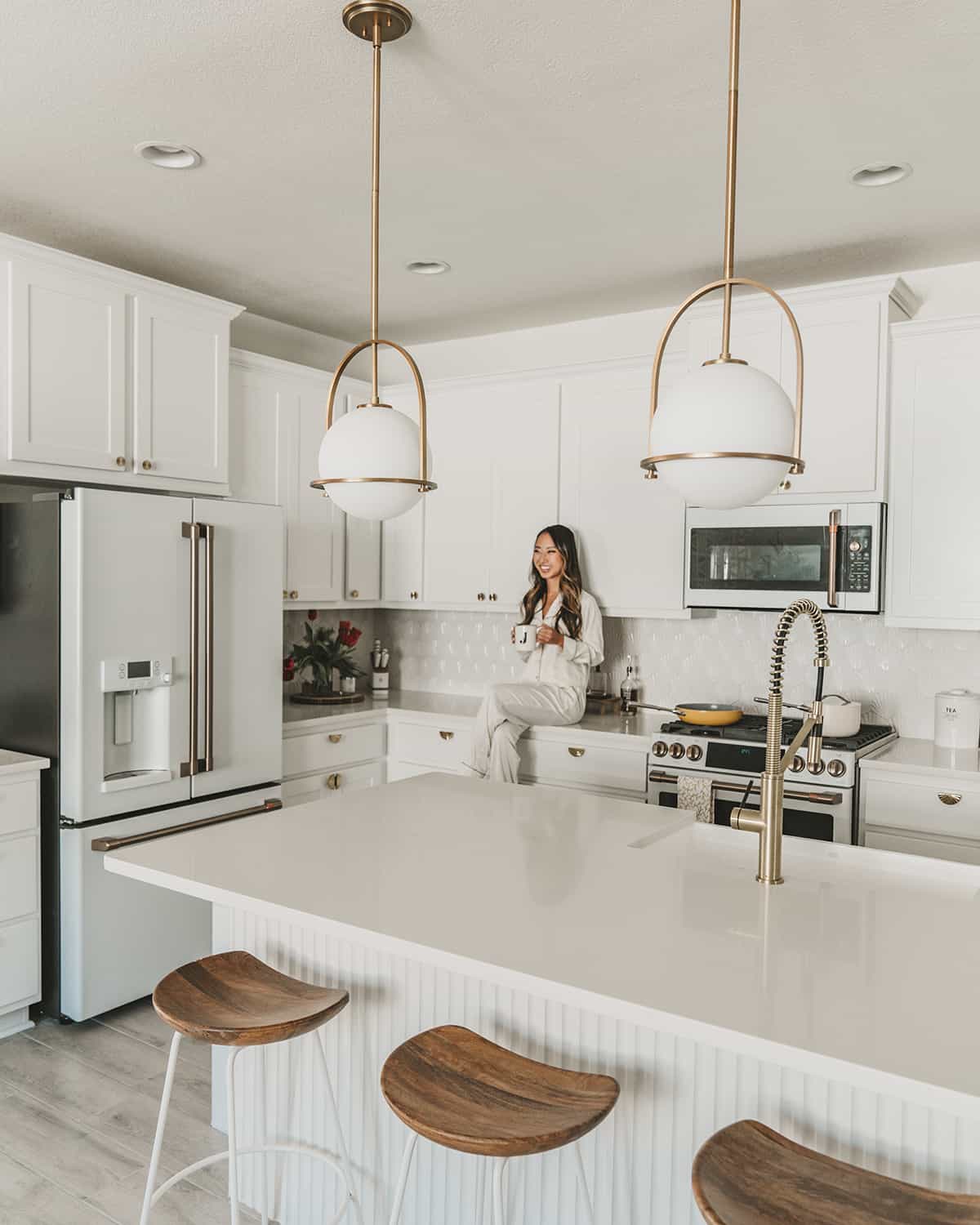 All-white kitchen design with white cabinets and white appliances | GE Cafe appliances