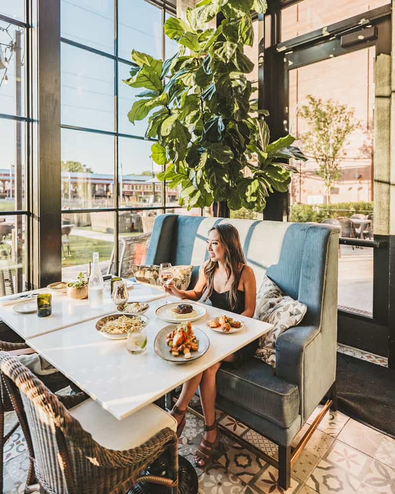 woman in Bacchus Kitchen + Bar - restaurant inside Hotel Vin 
